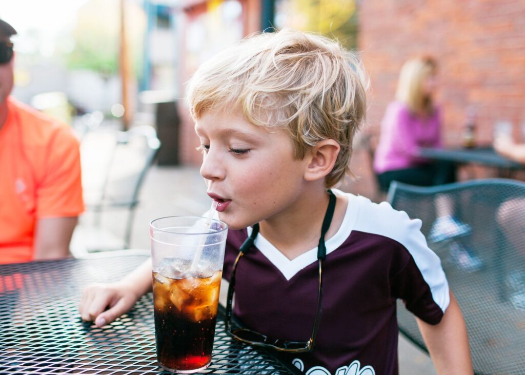 kid with soda